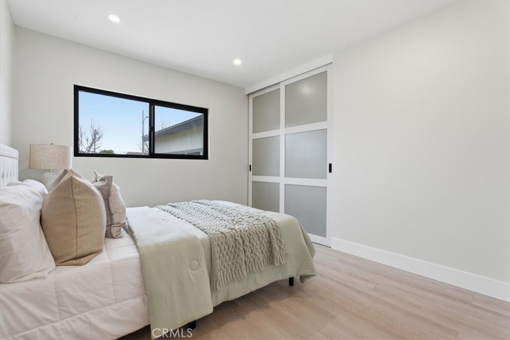 168 226th Street Carson, CA 90745 - Photo 24 of 40 a bedroom with a bed and a painting on the wall