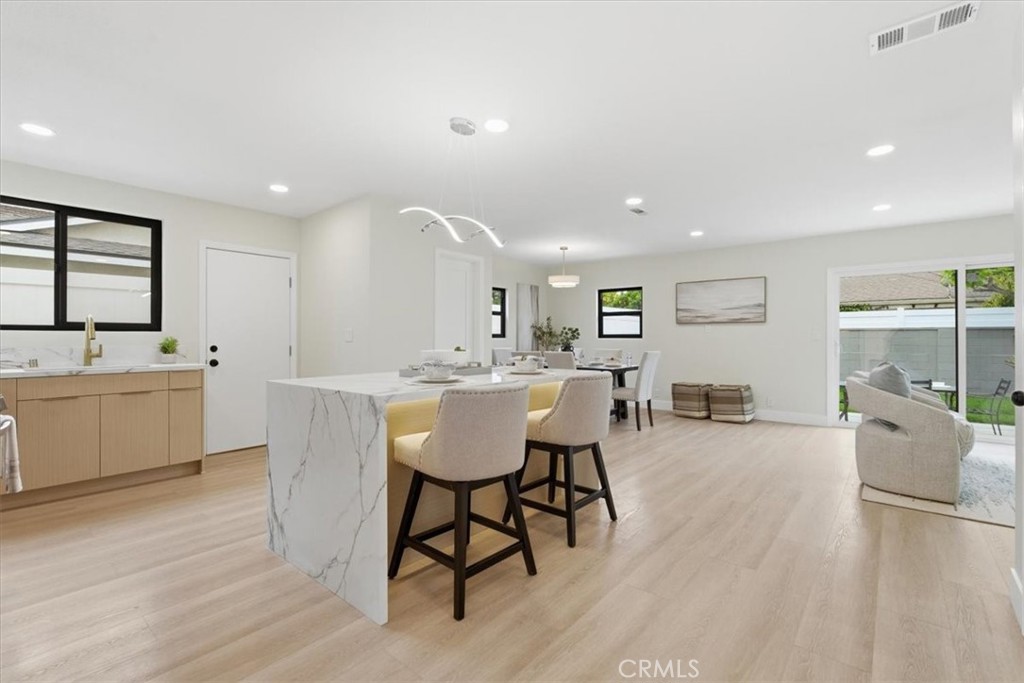 168 226th Street Carson, CA 90745 - Photo 6 of 40 a large white kitchen with a table and chairs