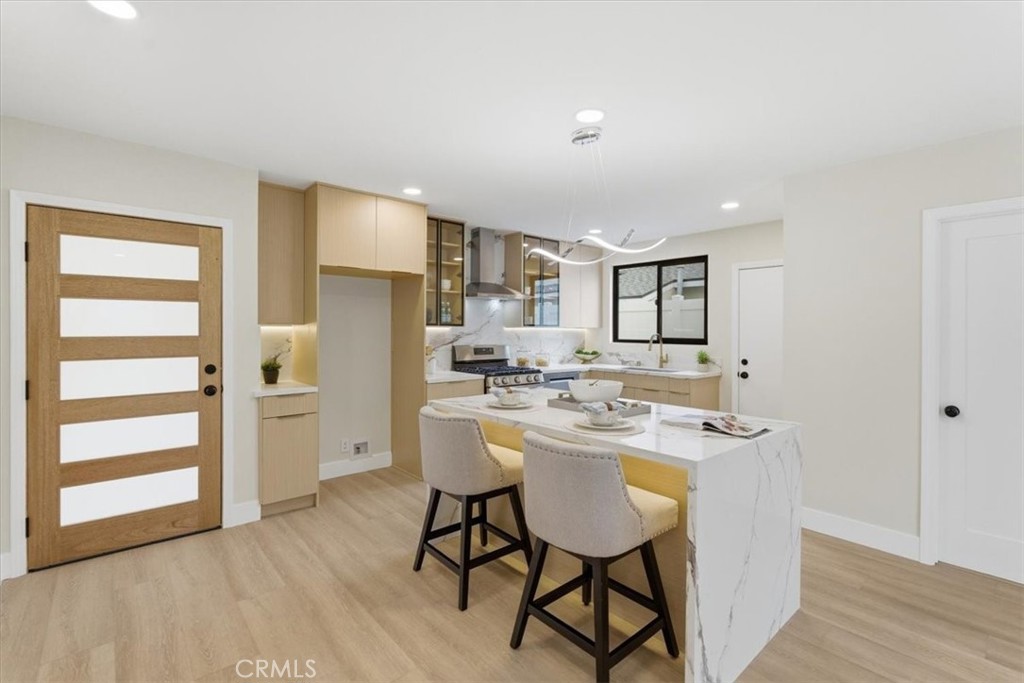 168 226th Street Carson, CA 90745 - Photo 7 of 40 a kitchen with a sink and chairs