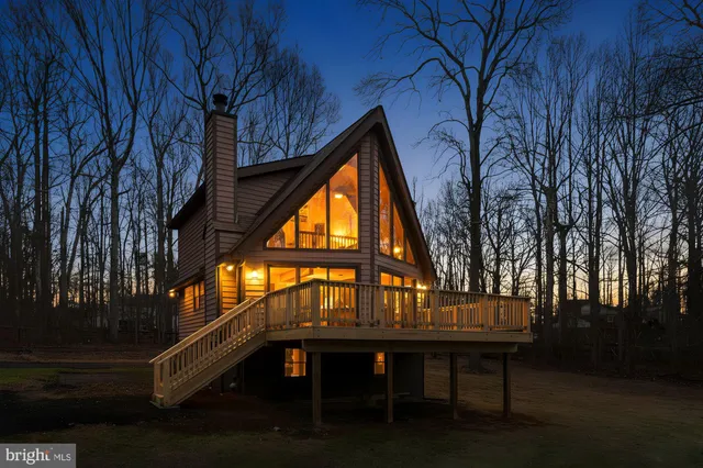 a balcony with table and chairs