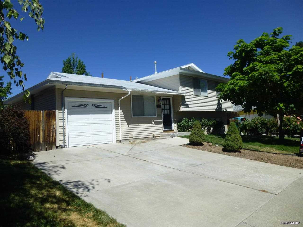 673 James Lane Reno, NV 89503 - Photo 1 of 1 a front view of a house with a garage