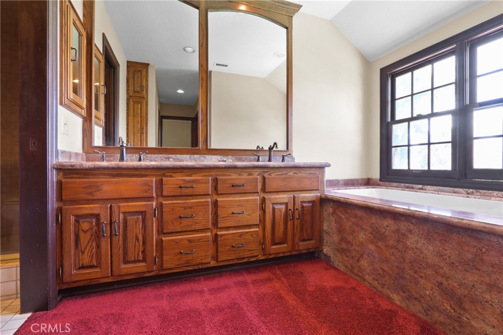 3142 Quail Run Road Rossmoor, CA 90720 - Photo 25 of 35 Primary suite bathroom with soaking tub and walk-in shower