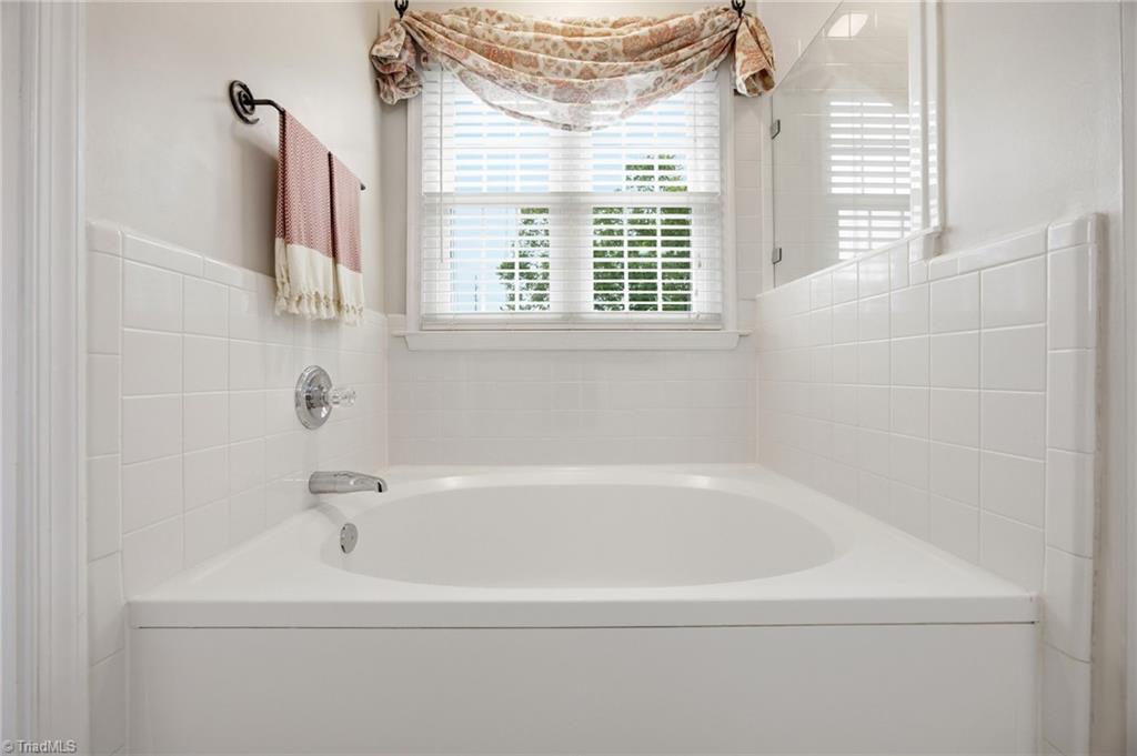 3659 Canopy Oak Court High Point, NC 27265 - Photo 25 of 42 Ensuite primary bathroom with separate shower and garden tub.
