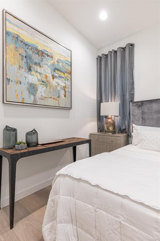4202 Bonham Street Dallas, TX 75229 - Photo 22 of 32 Bedroom with wood finished floors and recessed lighting