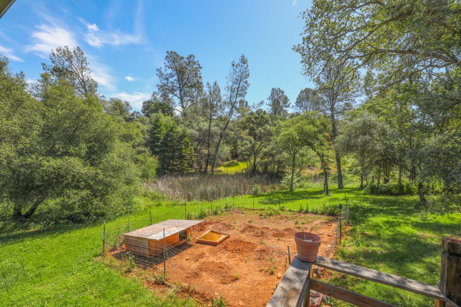12661 Krosens Road Marysville, CA 95901 - Photo 22 of 79 a backyard of a house with a yard and outdoor seating