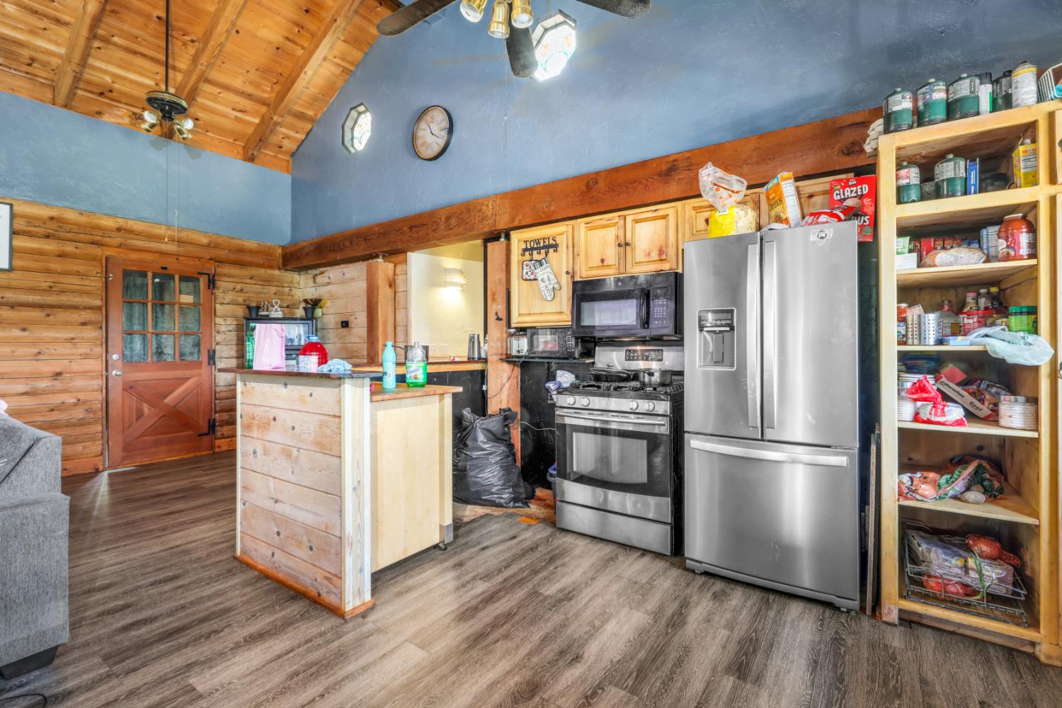 12661 Krosens Road Marysville, CA 95901 - Photo 5 of 79 a kitchen with stainless steel appliances a refrigerator and a wooden floor