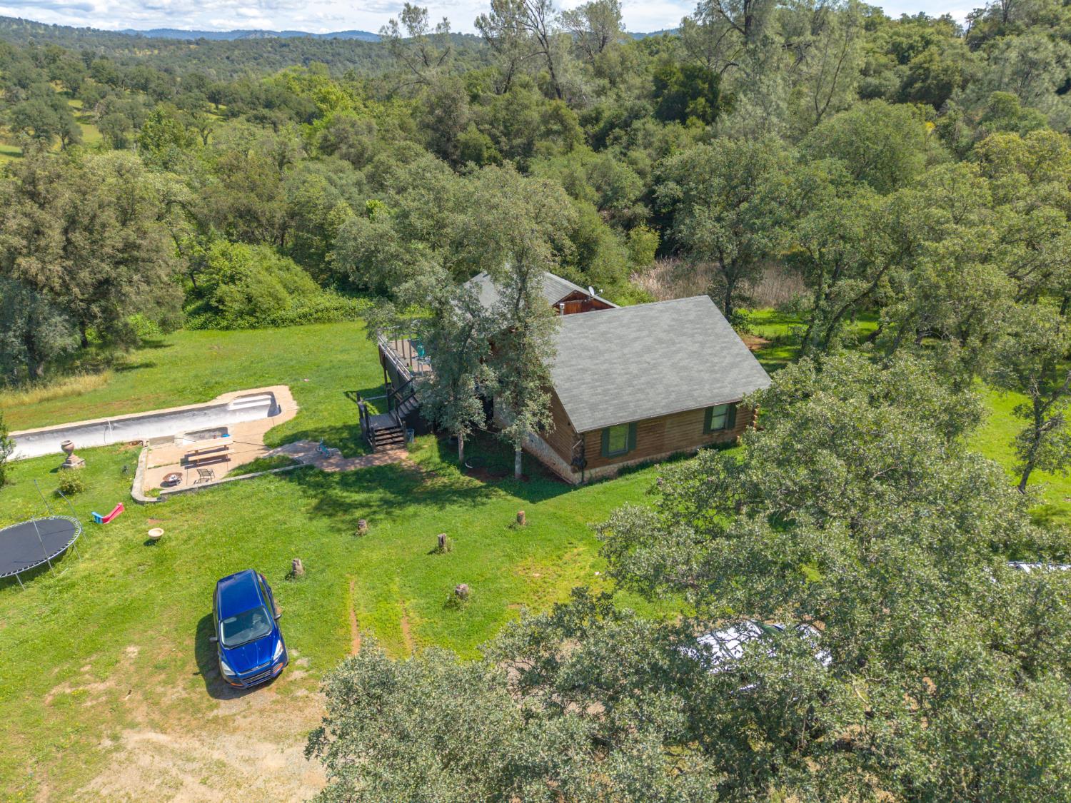 12661 Krosens Road Marysville, CA 95901 - Photo 67 of 79 a backyard of a house with a yard and lake view