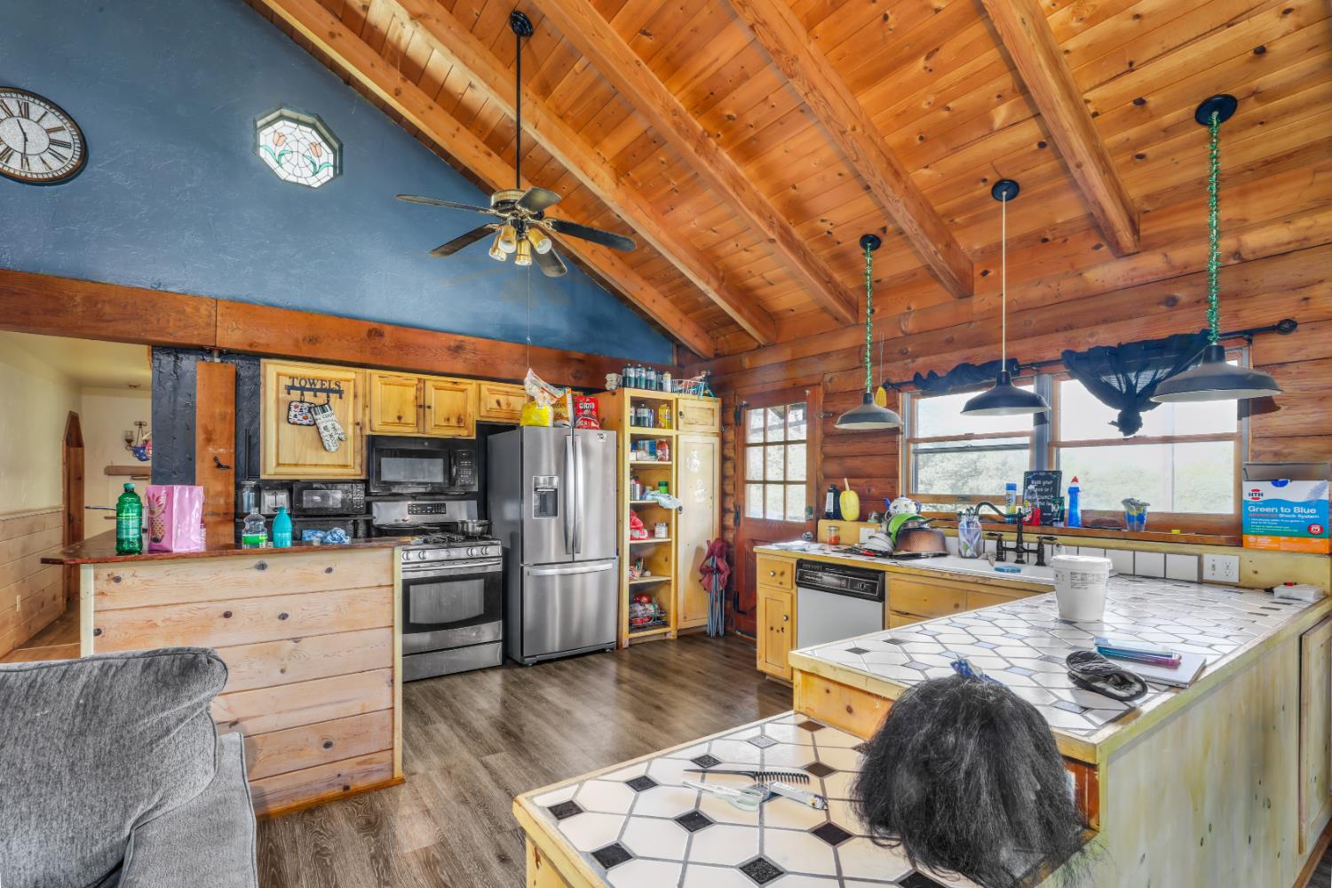 12661 Krosens Road Marysville, CA 95901 - Photo 10 of 79 a kitchen with stainless steel appliances kitchen island granite countertop a table chairs in it and wooden floors