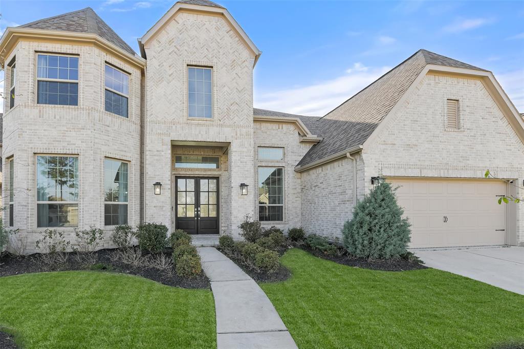 17366 Camillia Trail Conroe, TX 77302 - Photo 1 of 48 a front view of a house with a yard