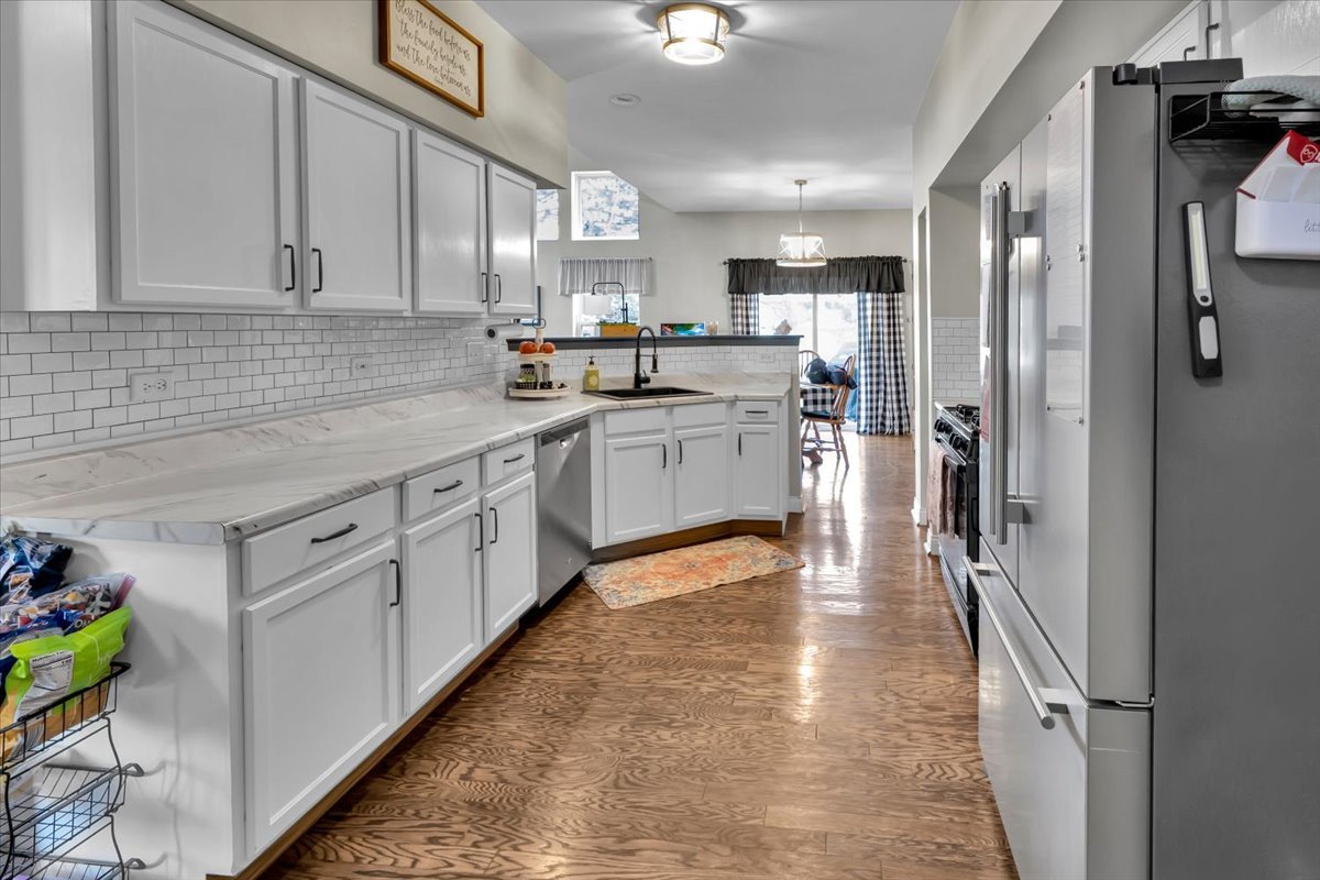 16501 Nottingham Court Lockport, IL 60441 - Photo 13 of 44 a kitchen with white cabinets and appliances