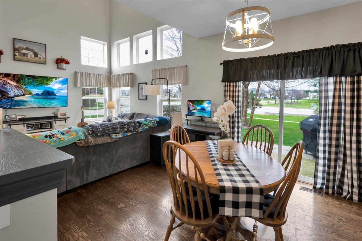 16501 Nottingham Court Lockport, IL 60441 - Photo 19 of 44 a view of a dining room with furniture a chandelier and window