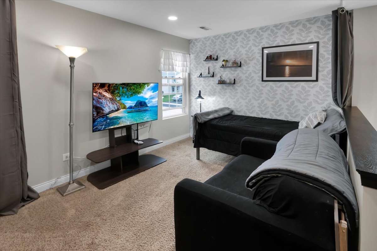 16501 Nottingham Court Lockport, IL 60441 - Photo 22 of 44 a living room with furniture and a flat screen tv