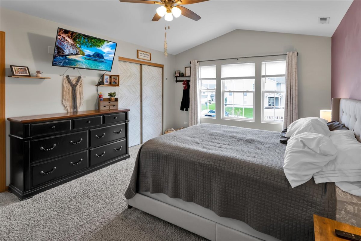 16501 Nottingham Court Lockport, IL 60441 - Photo 25 of 44 a bedroom with a bed and a flat screen tv