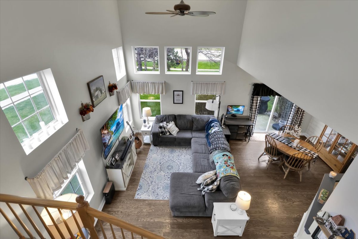 16501 Nottingham Court Lockport, IL 60441 - Photo 5 of 44 a living room with furniture a fireplace and a large window