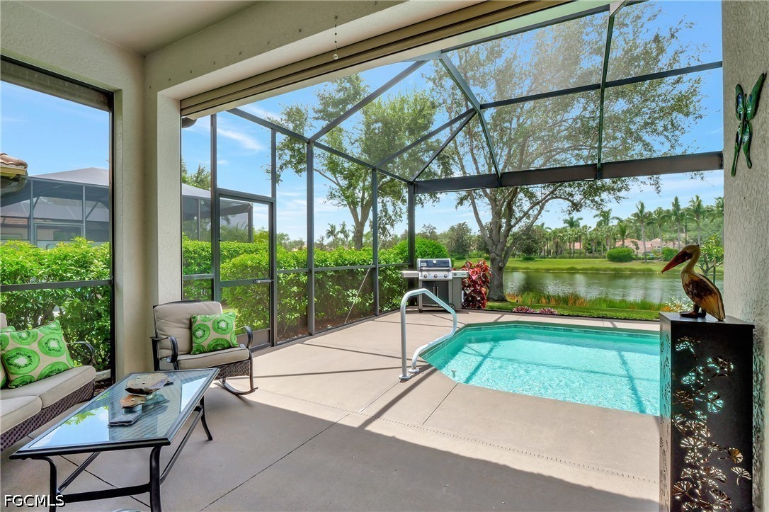 11230 Suffield Street Fort Myers, FL 33913 - Photo 28 of 42 a swimming pool with outdoor seating and a garden