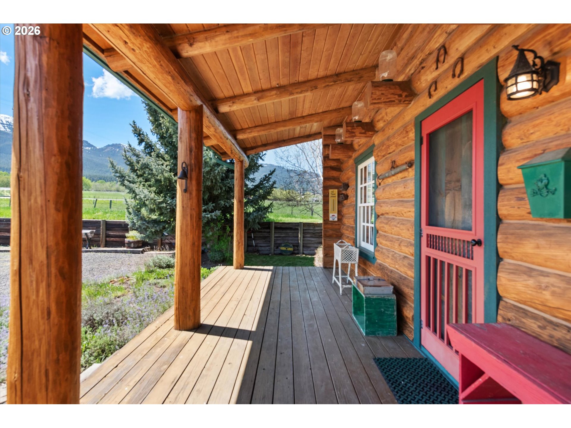 64782 Alder Slope Road Enterprise, OR 97828 - Photo 10 of 48 a view of backyard with a deck and wooden floor