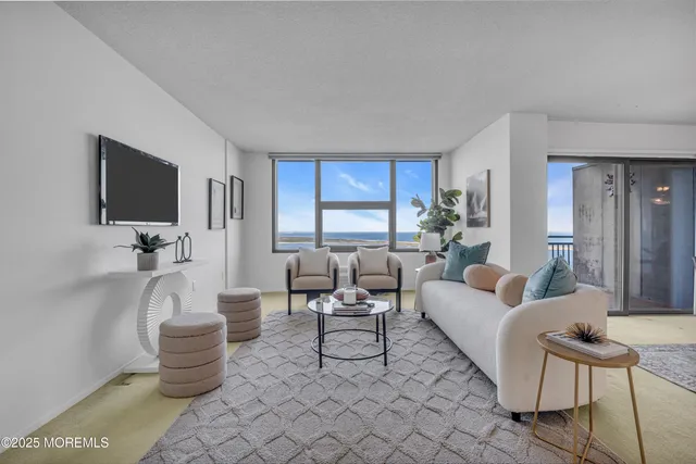 a dining room with furniture and a chandelier