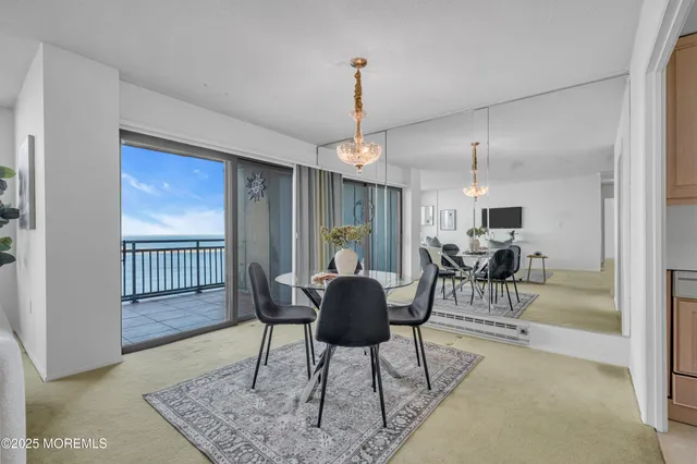 a living room with furniture a flat screen tv and a large window