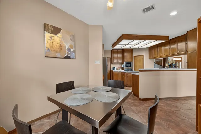 a kitchen with a stove a sink dishwasher and a refrigerator