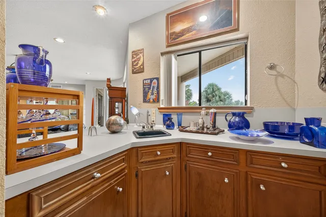 a kitchen with cabinets and appliances