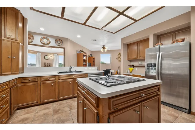 a kitchen with stainless steel appliances granite countertop a sink and cabinets
