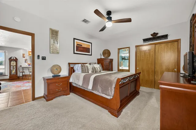 a view of a livingroom with wooden floor and furniture