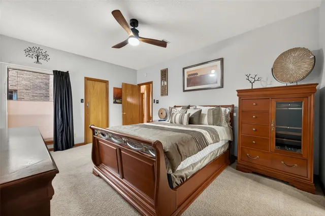 a spacious bathroom with a granite countertop sink and a mirror