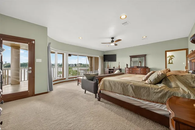 a living room with furniture and a floor to ceiling window