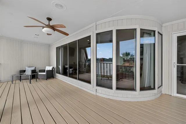 a kitchen with stainless steel appliances granite countertop a refrigerator a stove and a microwave with wooden floor