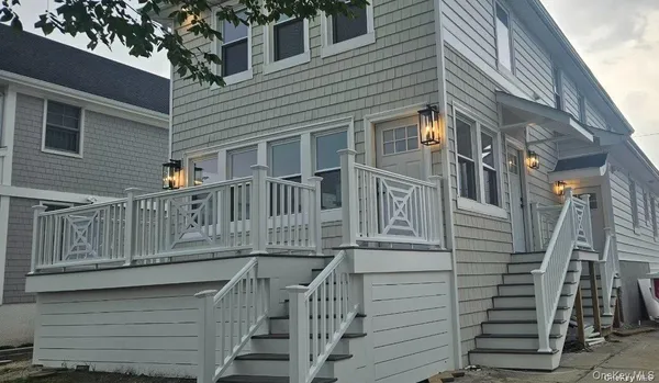 a view of a house with a small yard