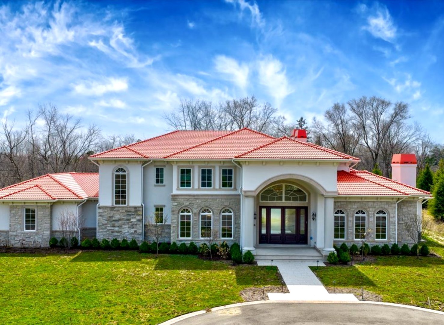 2665 Bentley Road Highland Park, IL 60035 - Photo 1 of 56 a view of a white house with a big yard and large trees
