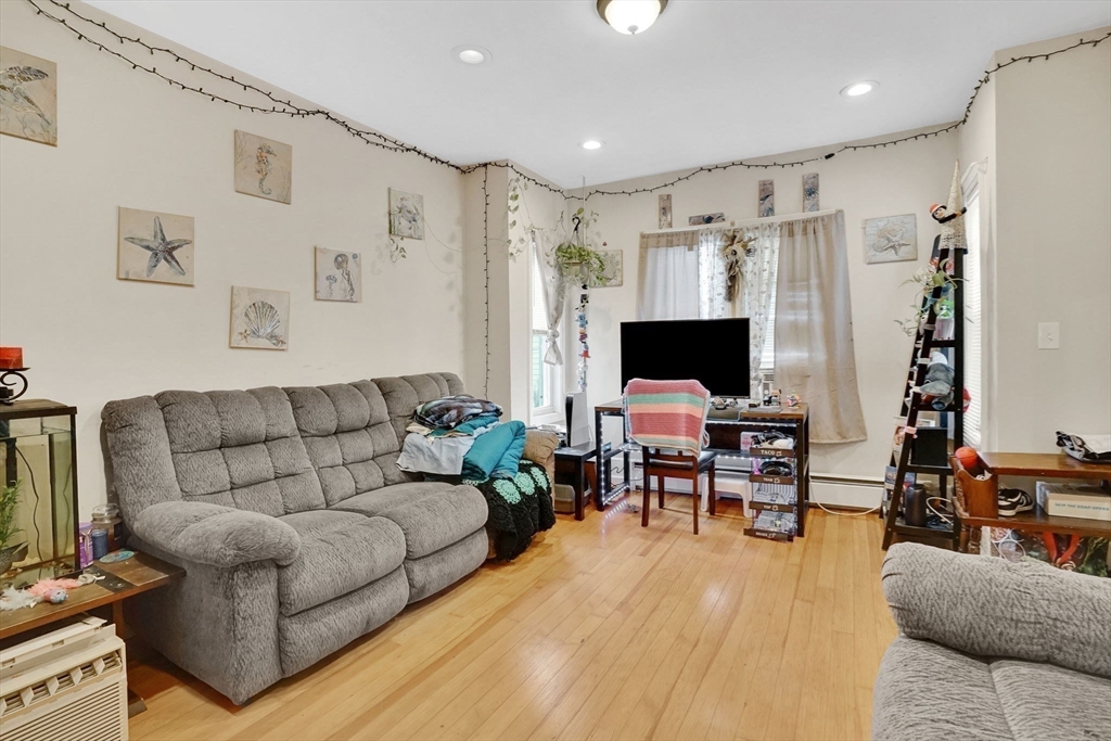 38 Whitman Street Chicopee, MA 01013 - Photo 20 of 29 a living room with furniture and a flat screen tv