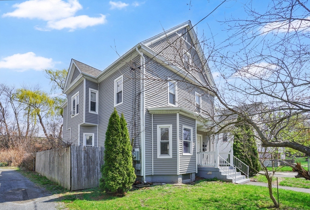 38 Whitman Street Chicopee, MA 01013 - Photo 2 of 29 front view of a house with a yard