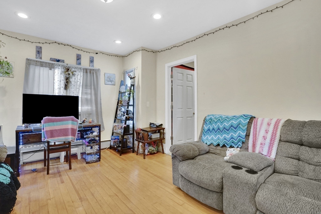 38 Whitman Street Chicopee, MA 01013 - Photo 21 of 29 a living room with furniture and a flat screen tv