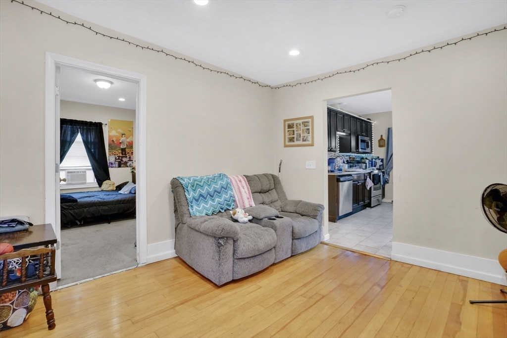 38 Whitman Street Chicopee, MA 01013 - Photo 22 of 29 a living room with furniture and a flat screen tv