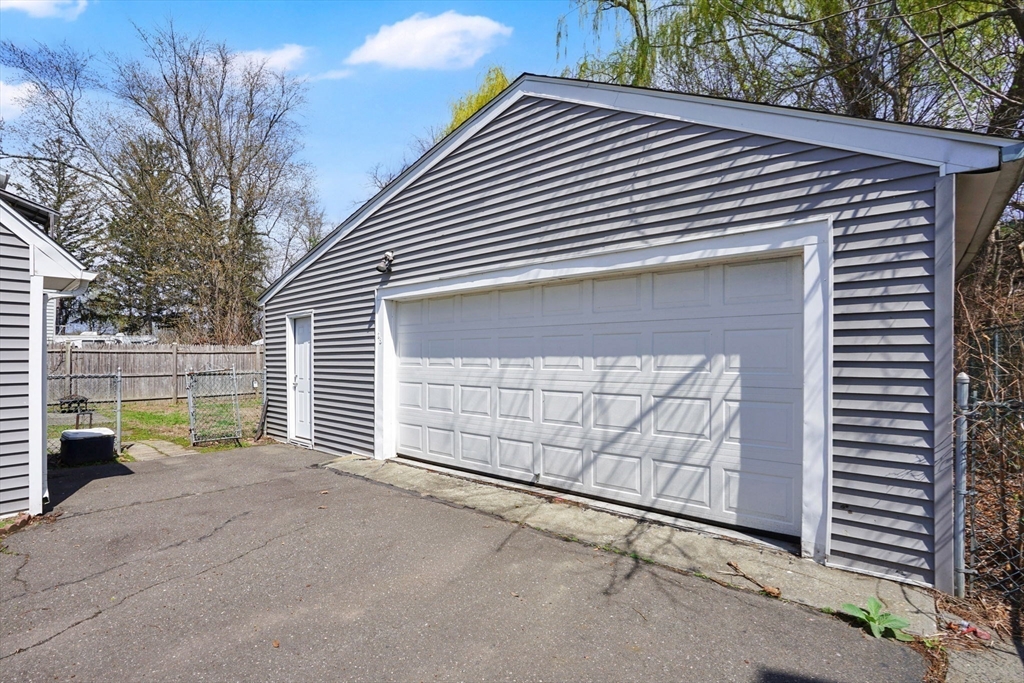 38 Whitman Street Chicopee, MA 01013 - Photo 26 of 29 a front view of a house with a garage