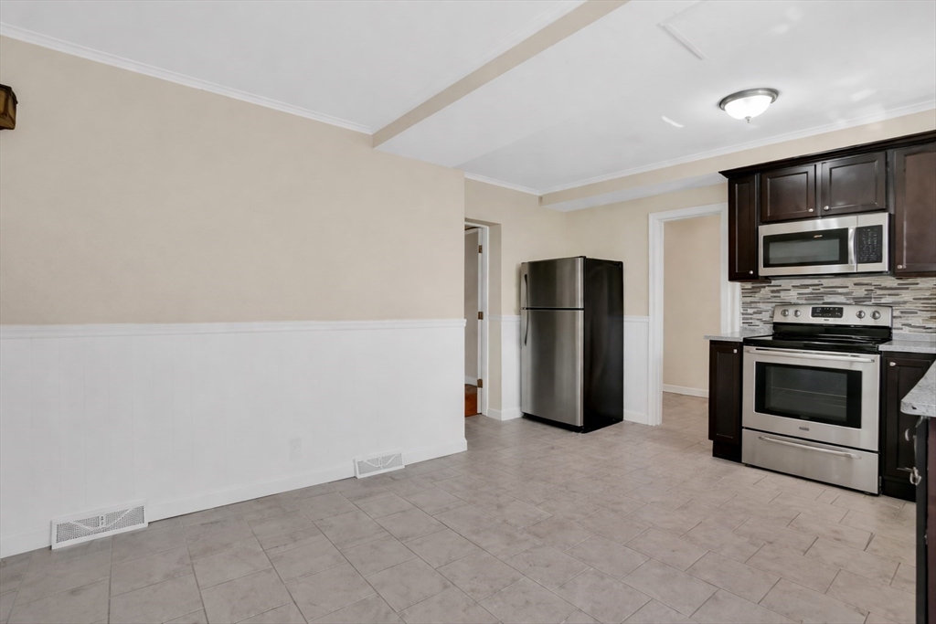 38 Whitman Street Chicopee, MA 01013 - Photo 5 of 29 a kitchen with refrigerator and oven