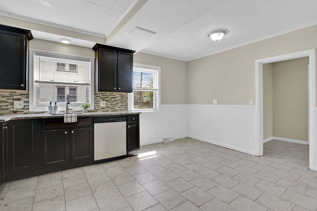 38 Whitman Street Chicopee, MA 01013 - Photo 6 of 29 a kitchen with a sink and a stove