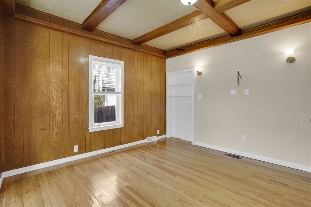 38 Whitman Street Chicopee, MA 01013 - Photo 9 of 29 a view of an empty room with wooden floor and a window