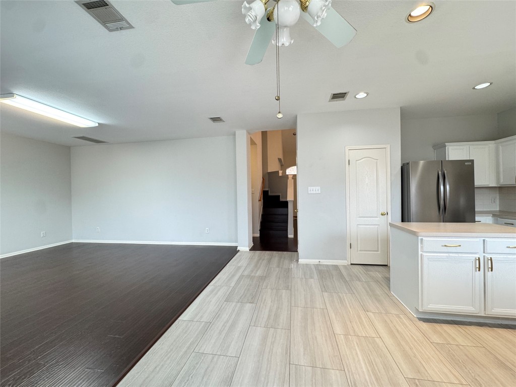 3404 Bratton Ridge Crossing Austin, TX 78728 - Photo 25 of 25 a view of a kitchen with wooden floor and a sink