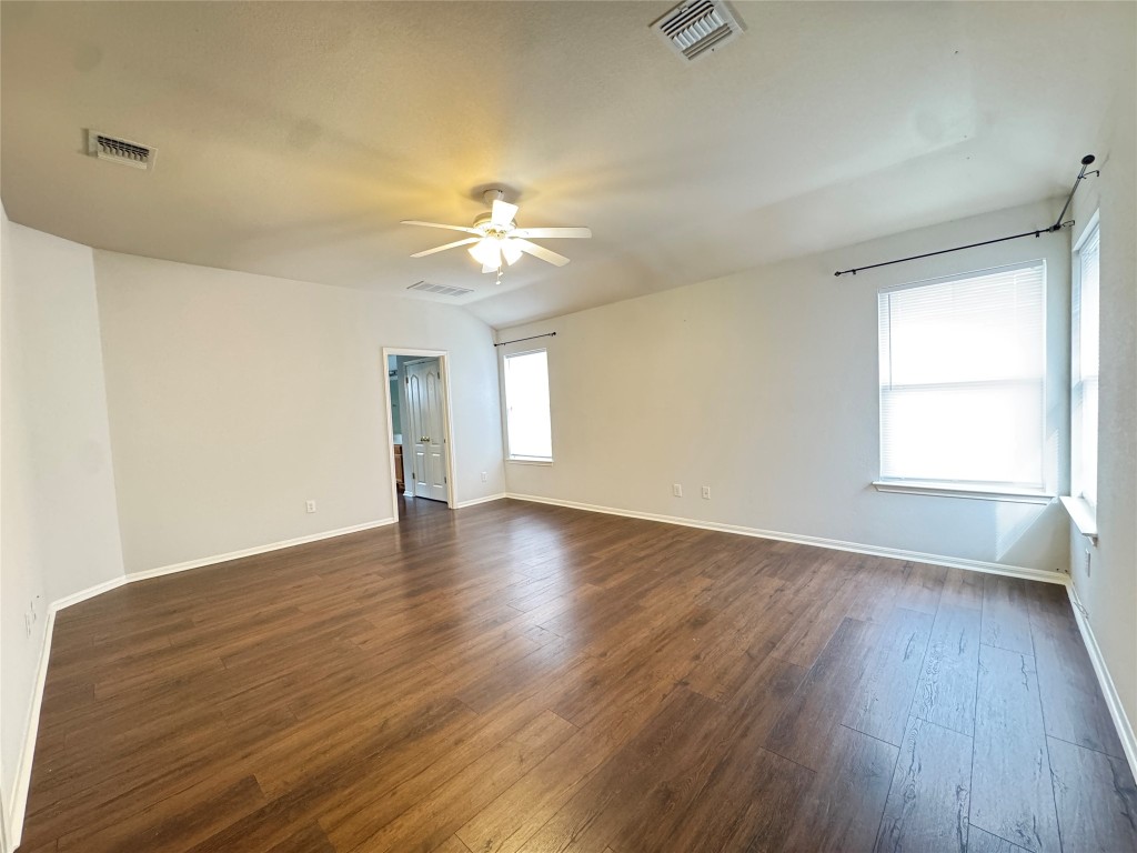 3404 Bratton Ridge Crossing Austin, TX 78728 - Photo 15 of 25 an empty room with wooden floor and windows