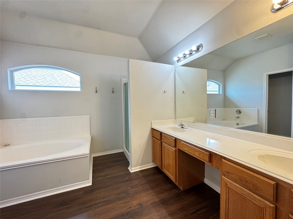 3404 Bratton Ridge Crossing Austin, TX 78728 - Photo 16 of 25 a bathroom with a tub sink and mirror