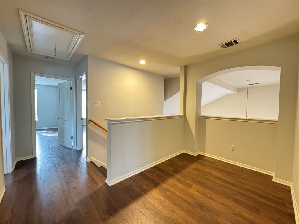 3404 Bratton Ridge Crossing Austin, TX 78728 - Photo 17 of 25 wooden floor in an empty room with a window