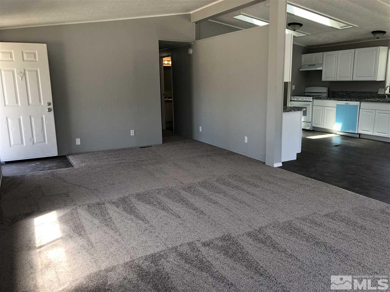 17425 Fantail Street Reno, NV 89508 - Photo 5 of 17 a view of a kitchen with wooden floor and a sink