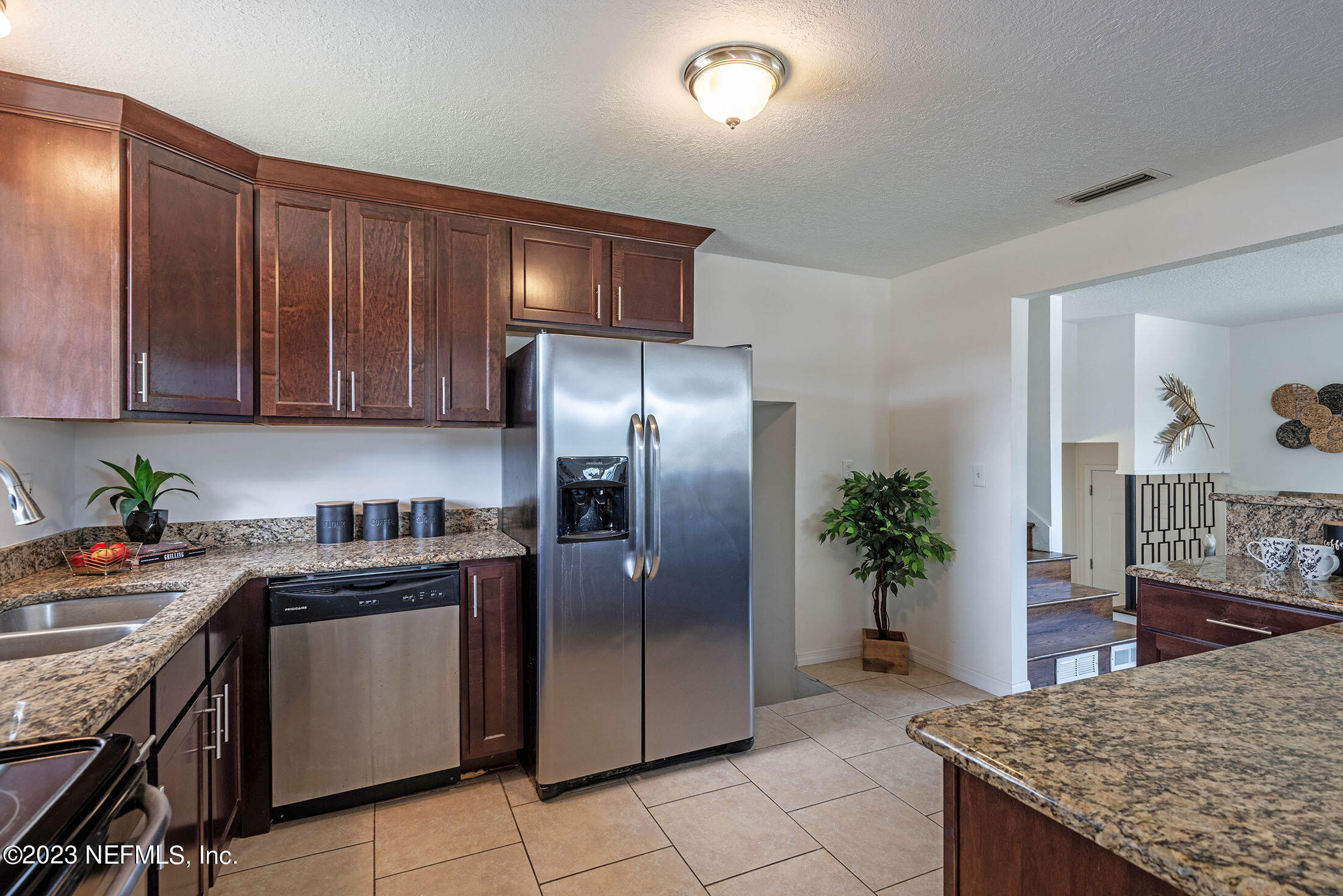 8007 Alderman Road Jacksonville, FL 32211 - Photo 11 of 63 a kitchen with stainless steel appliances granite countertop a stove a refrigerator and a sink