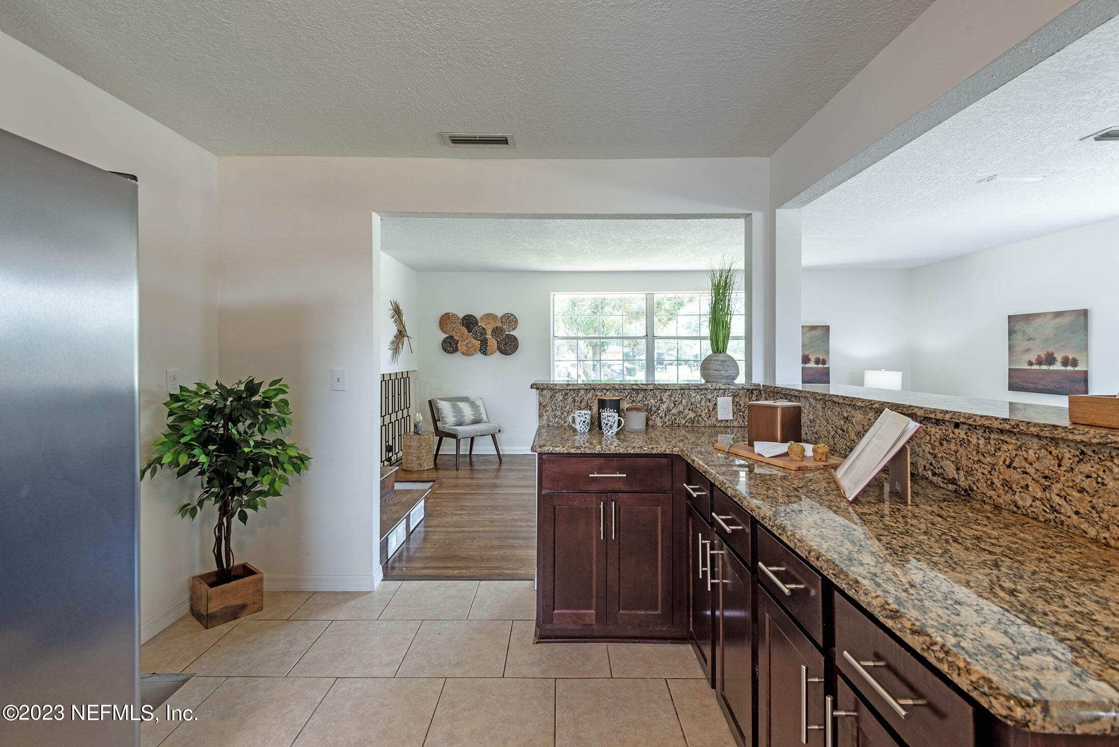 8007 Alderman Road Jacksonville, FL 32211 - Photo 14 of 63 a kitchen with granite countertop a sink and a stove