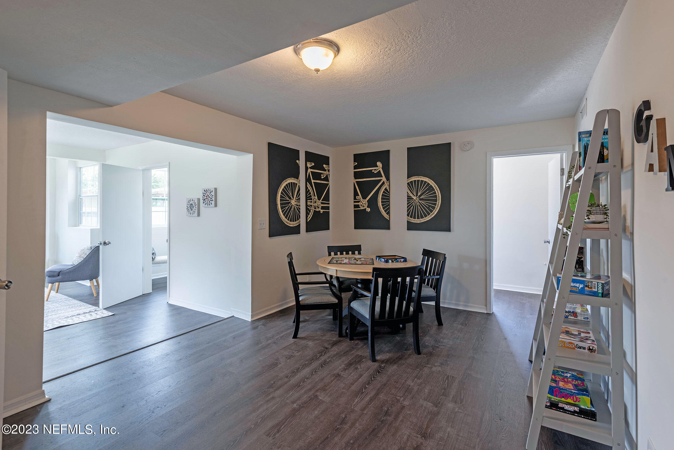 8007 Alderman Road Jacksonville, FL 32211 - Photo 15 of 63 a view of a dining room with furniture and wooden floor