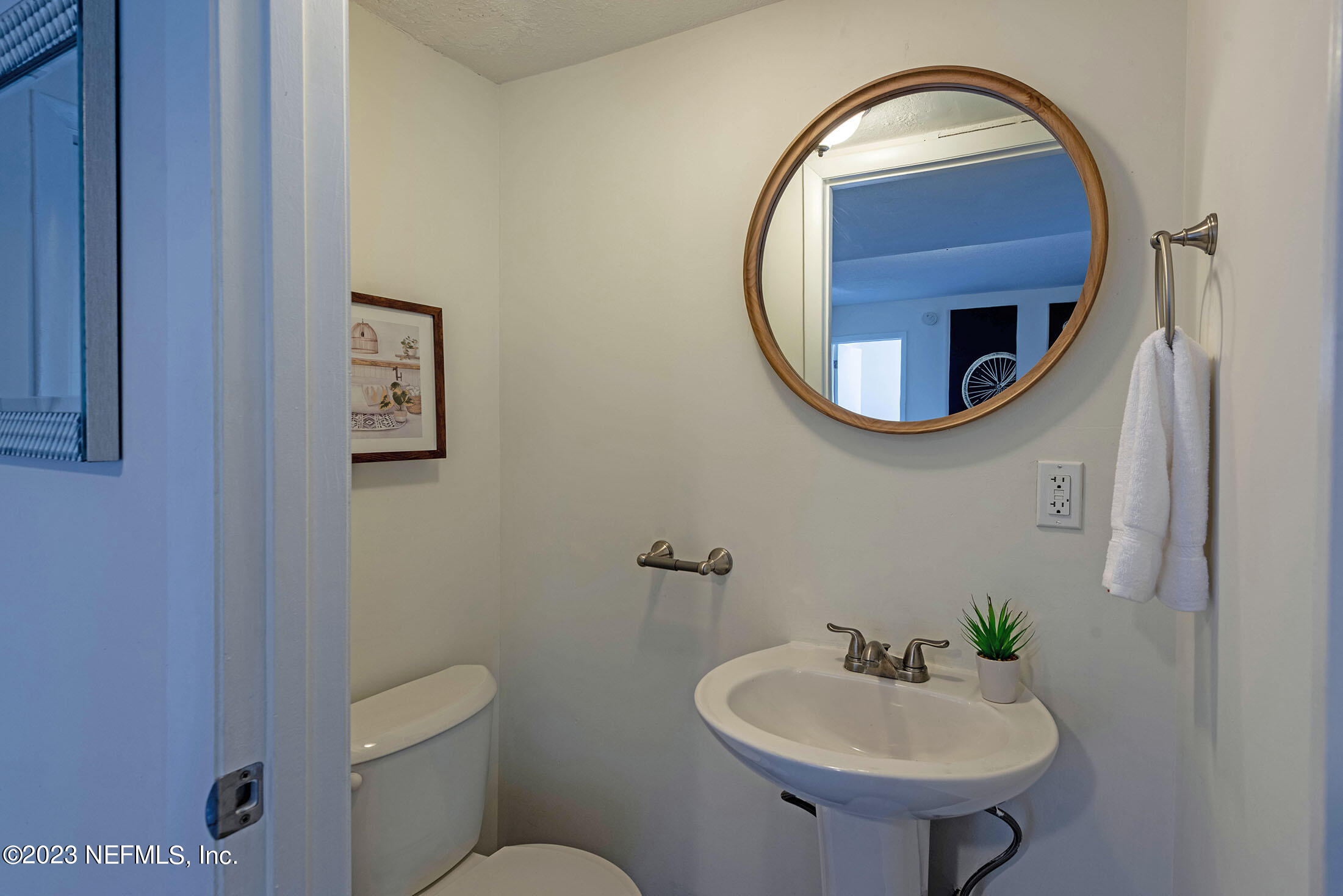 8007 Alderman Road Jacksonville, FL 32211 - Photo 17 of 63 a bathroom with a sink and mirror