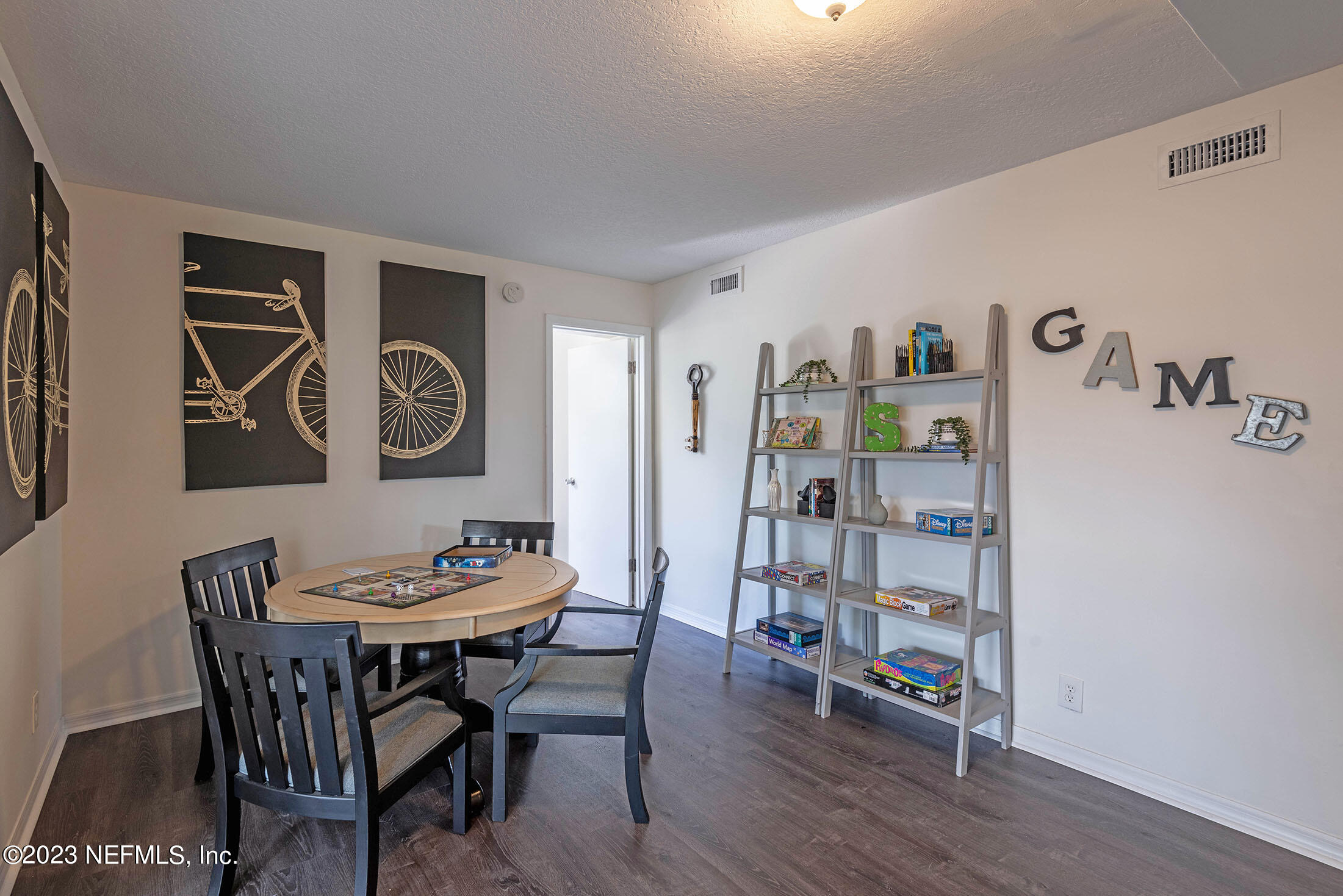 8007 Alderman Road Jacksonville, FL 32211 - Photo 18 of 63 a view of a dining room with furniture and wooden floor