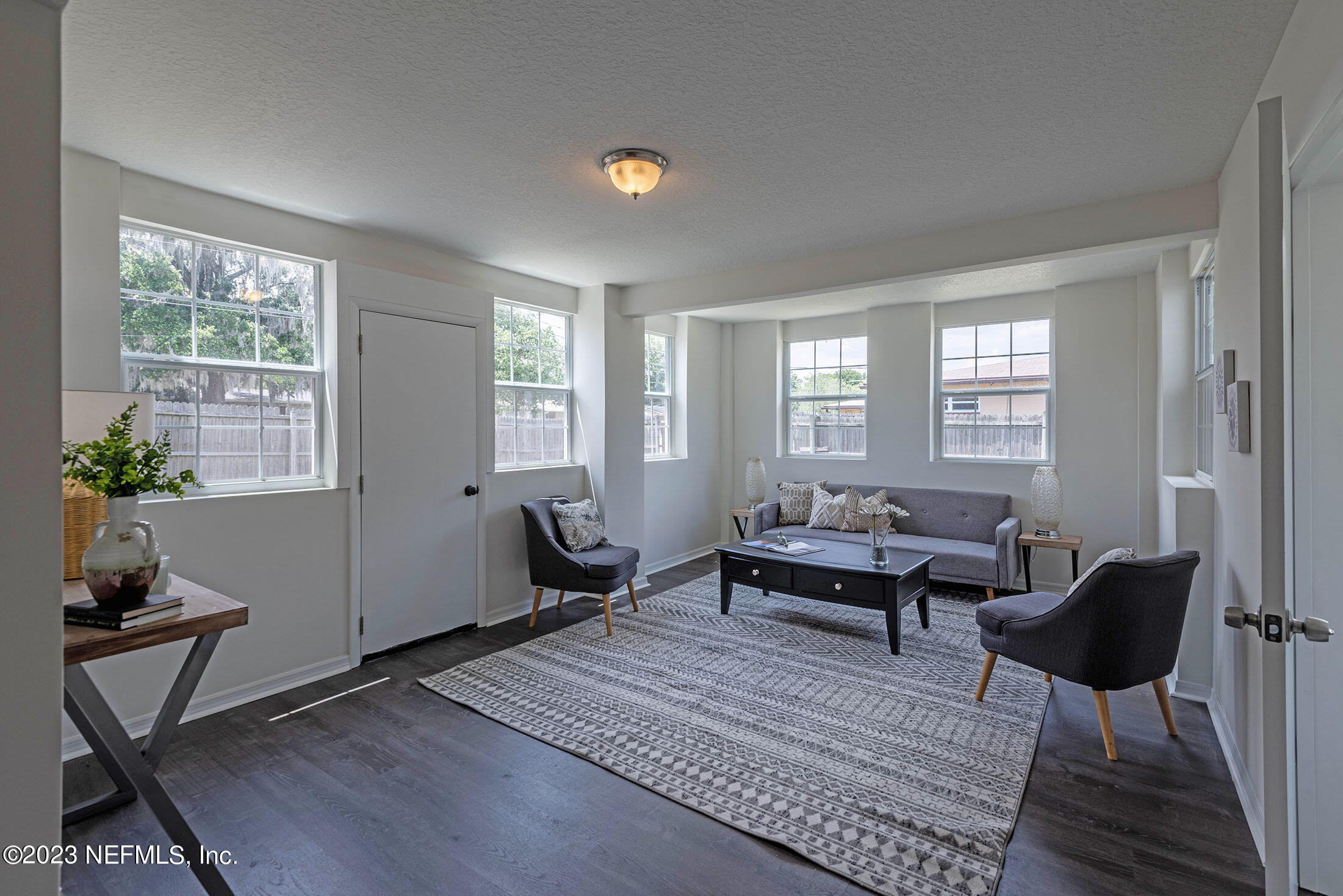 8007 Alderman Road Jacksonville, FL 32211 - Photo 19 of 63 a living room with furniture a rug and a window
